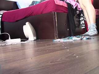 Amateur wife dancing naked at home. Amateur woman has fun trying on clothes and cutting them.