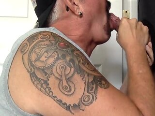 Gaydaddy With Tattoos Sucks Hard Cock In Gloryhole Bj