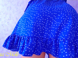 Girl teases her beautiful pink pussy from under the skirt, shakes her juicy ass and cums with moans