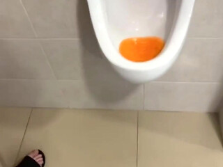Filming the Guy Peeing Next to Me at the Urinal of the Pool Toilets