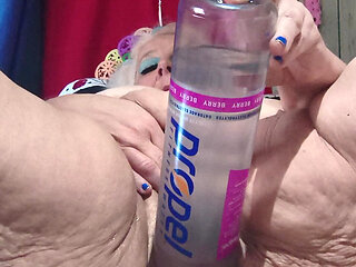 Big Bottle Plugged Clit Cunt