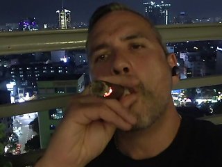 Uncut daddy smokes cigar and jerks on balcony PREVIEW