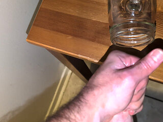 Fat man jerking his hard cock and cumming in a glass