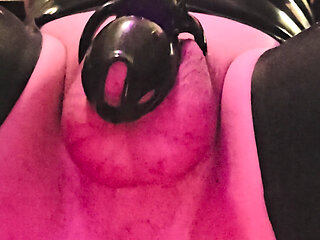 rubber sissy locked in chastity being fucked in the ass by a fuck machine