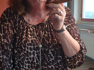 Smoking a cigar and enjoying a warm drink