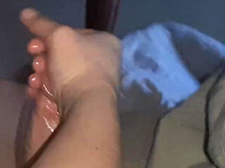 Handjob While Playing in Bed