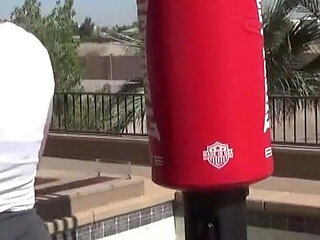 Smoking outdoor with the boxing muscled lady