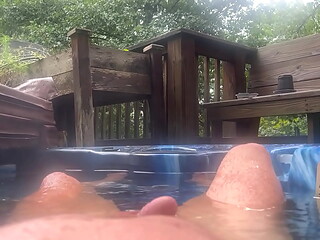 Cock rising from the hot tub
