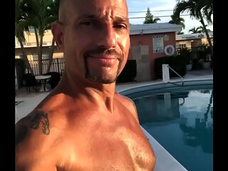 SUNNY DAY OUTSIDE BY THE POOL