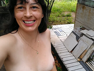 Wife walking naked outside. She makes pee and touch herself.