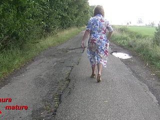 walking naked with nylons , high heels down the street.