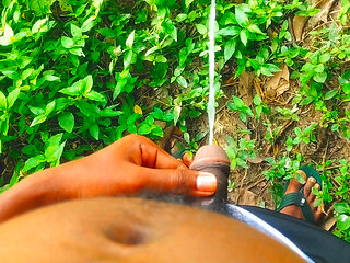 Indian hairy cock pissing outdoor.