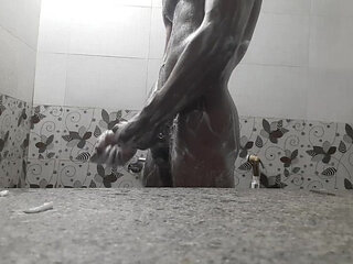 Horny boy in the bathroom showering