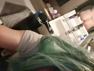 Crossdresser Pina in Bathroom Green Wig