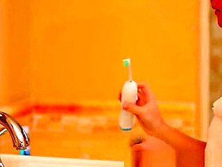 Petite blonde teen 18+ plays with toothbrush
