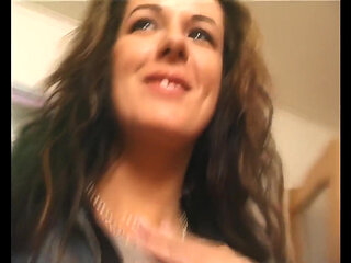 Beautiful and Shy Brunette Undresses in Front of a Camera