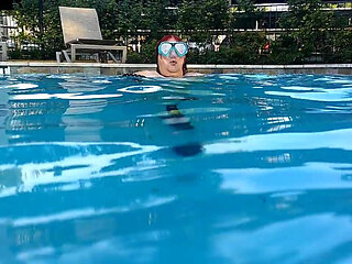 Couple Underwater Diving and Swimming
