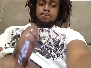 Handsome black man stroking his big dick