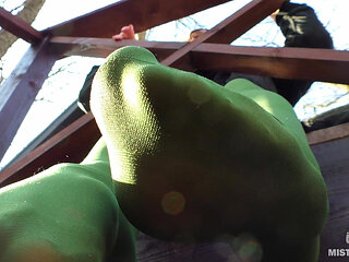 Goddess in Green Pantyhose Teases with Her Feet on the Porch