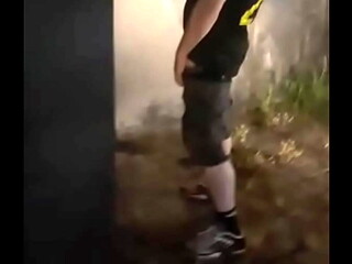 Helping him pee in the street