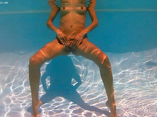 Outdoor sexy nude swimming by exhibitionist girl