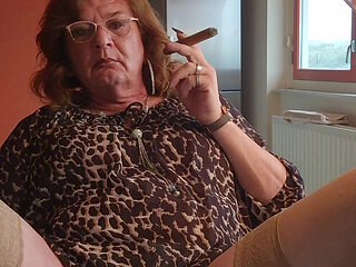 Enjoying my glass dildo while smoking a cigar