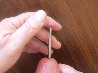 Masturbating my smooth cock with sounding rods before cumming