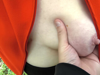 beating her tits in the woods