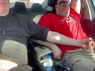 Stroking our dicks in the car in the parking lot