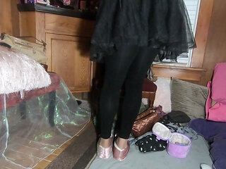 Cute T-girl in frilly dress and black tights showing off her toenail polish