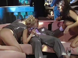 2 Sluts Share an Italian Cock in a Nightclub Among the People