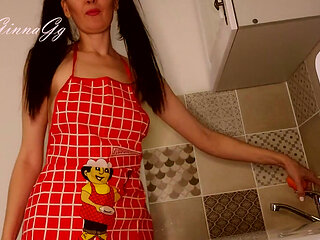 Hot housewife sexually rustles her apron in the kitchen
