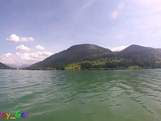 Jerking off underwater and pumping cum into the water in a stunning mountain lake.