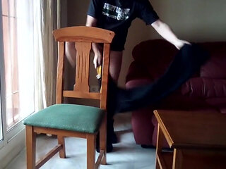 John is taking a big piss on the diningroom chair