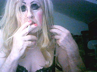 Trashy tranny cumslut Sarah enjoys a smoke after being fucked by random old strangers at a dogging site