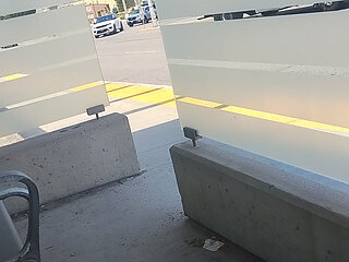 Exposing tiny cock in broad daylight at public bus stop.