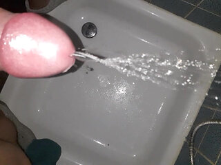 Horny pissing in the bathroom