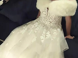Making love to bride's luxurious wedding gown and white fur shawl