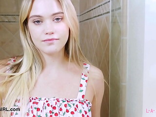 Elegant fair-haired model enjoys a sensual bath