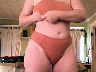 Big boobed Memphis masturbates in a bodystocking