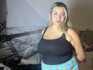 Cute American teen with huge tits tries on tops for your cum