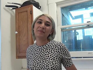 Adorable blonde masturbates on the kitchen counter