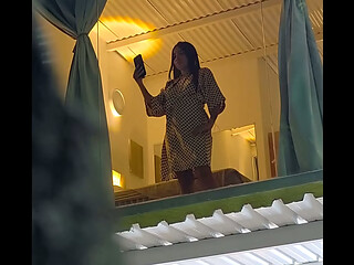 I spy on my neighbor from the street and she catches me