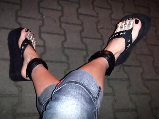 beautiful feet and very high flip-flops