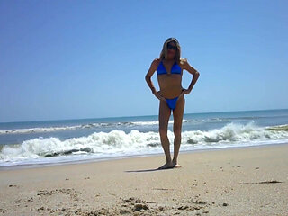 Shiny royal blue thong on the beach