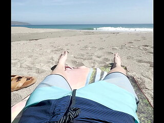 Teen jerks off on public beach