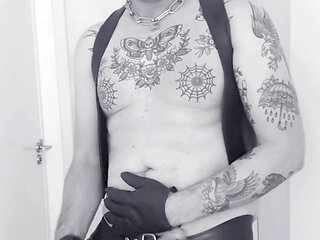 Leatherstudx in very tight leatherchaps, tattooed, pierced and a big cock!