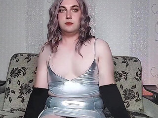 Playful femboy teasing with skirt in windy street