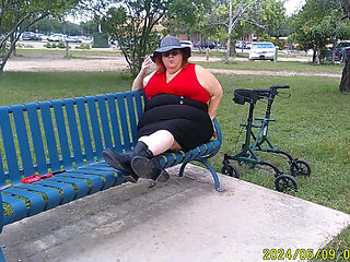Nurse Vicki Smoking in the Park on a Bench All Dressed up