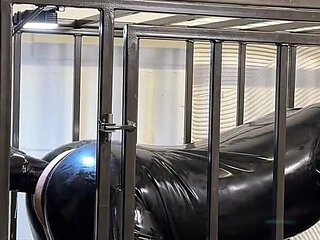 Anal Stretching a Caged Gimp